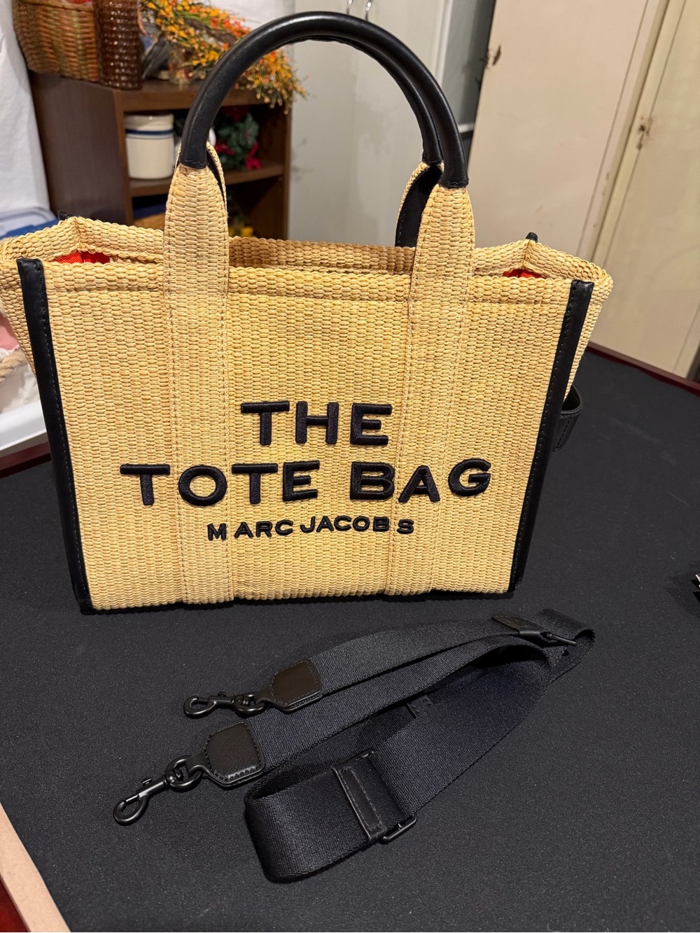 Marc Jacob’s woven straw tote with leather handles and trim